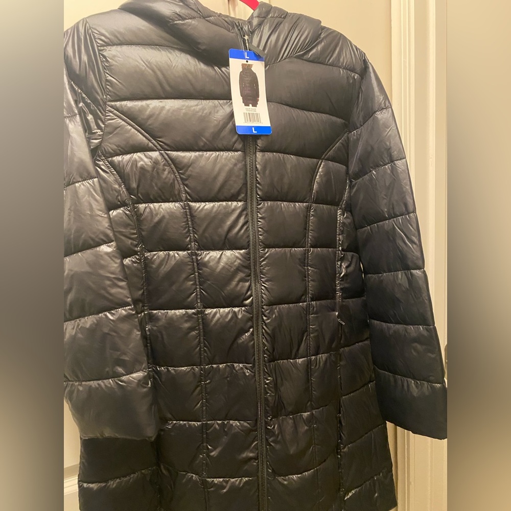 Stay warm in this knee length puffer jacket